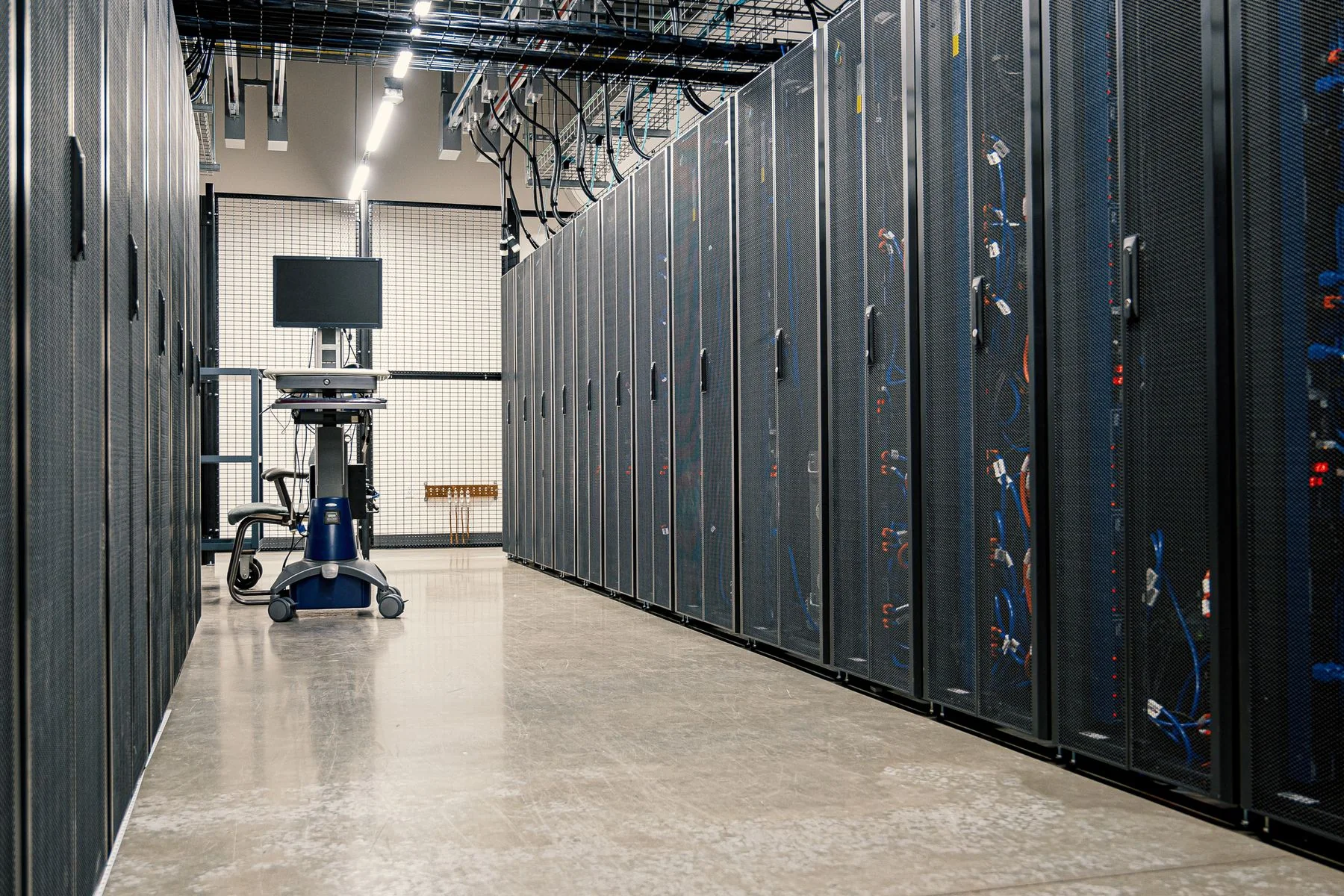 Modern data center corridor lined with server racks