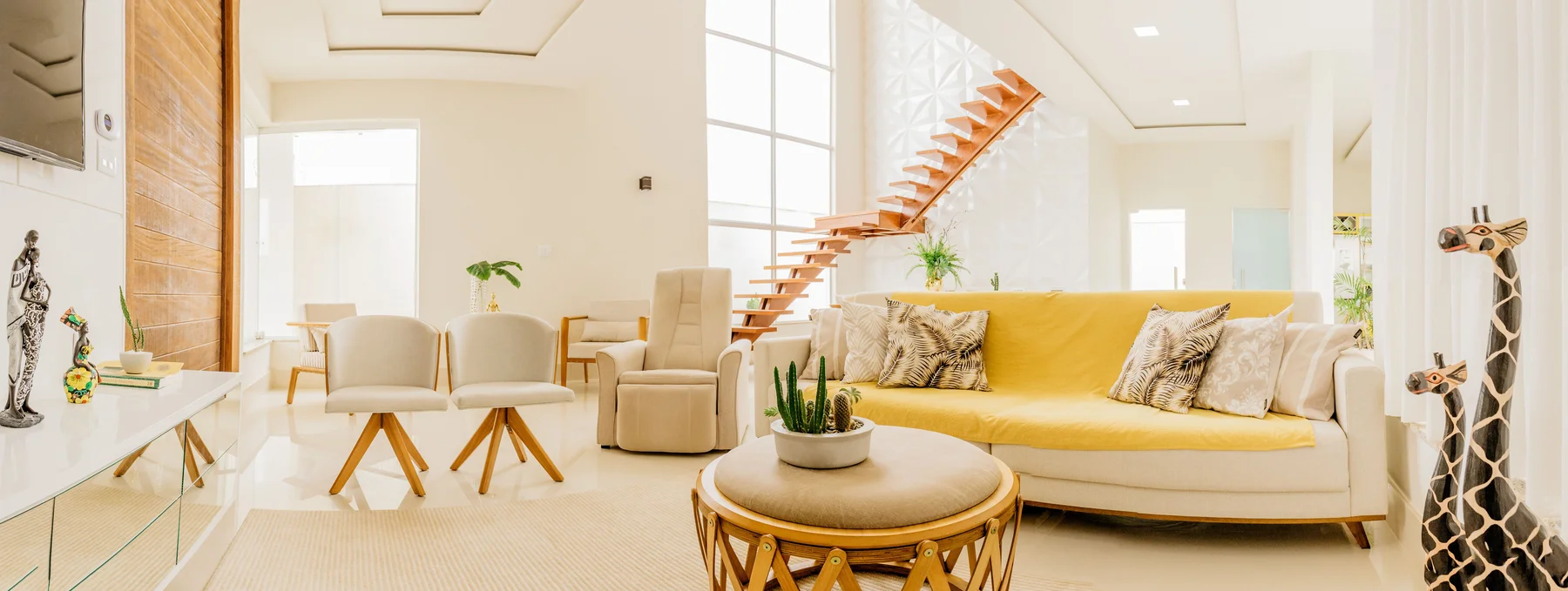 Bright, spacious modern living room styled with minimalist furniture and natural light Bright, spacious modern living room styled with minimalist furniture and natural light