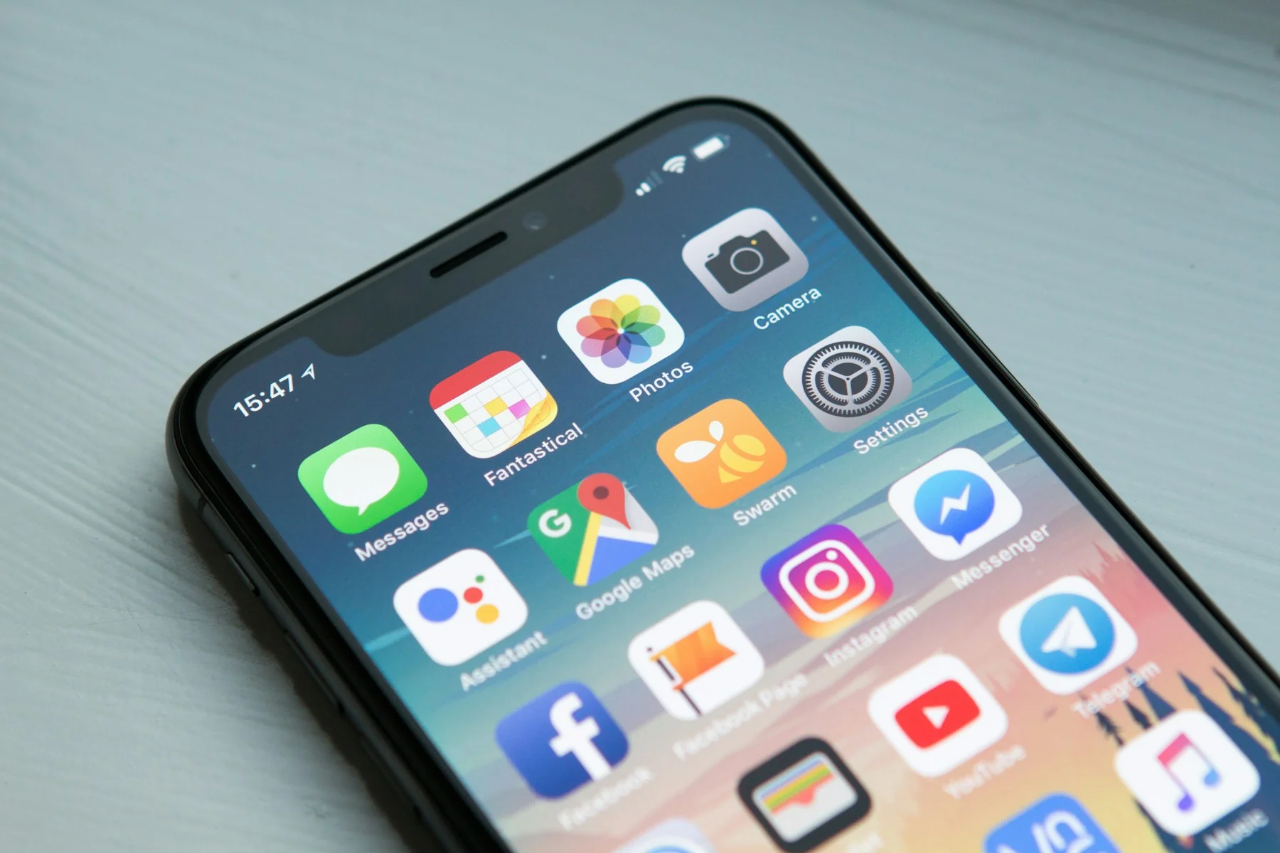 Close-up of a phone screen showing social media apps