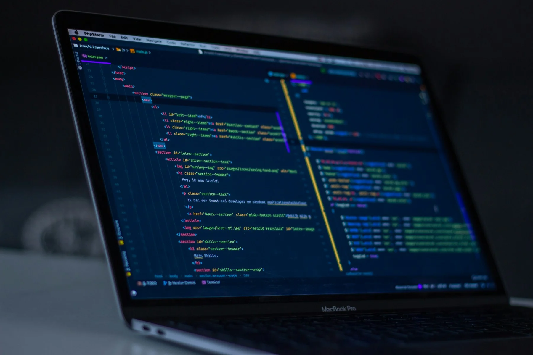 Close-up of code in a dark-mode editor on a laptop