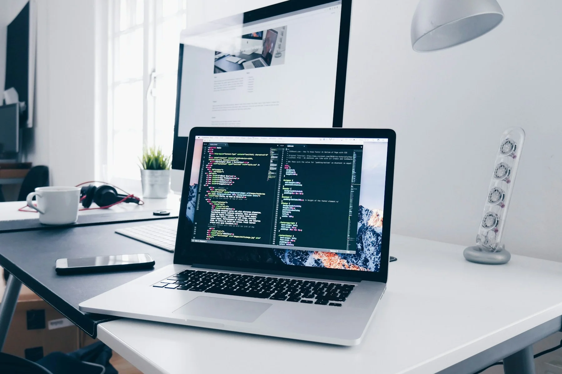 Developer working on a website build on a laptop
