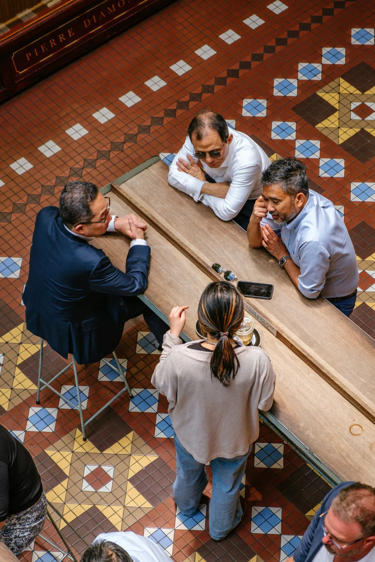 Colleagues gathered around a table in an open, collaborative discussion